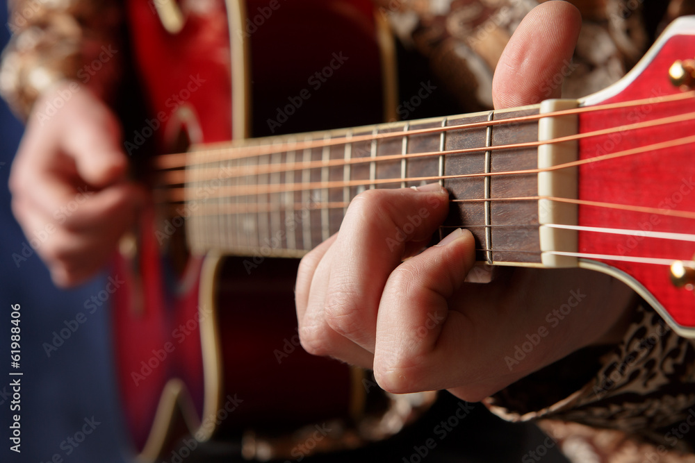 Guitarist playing an acoustic guitar