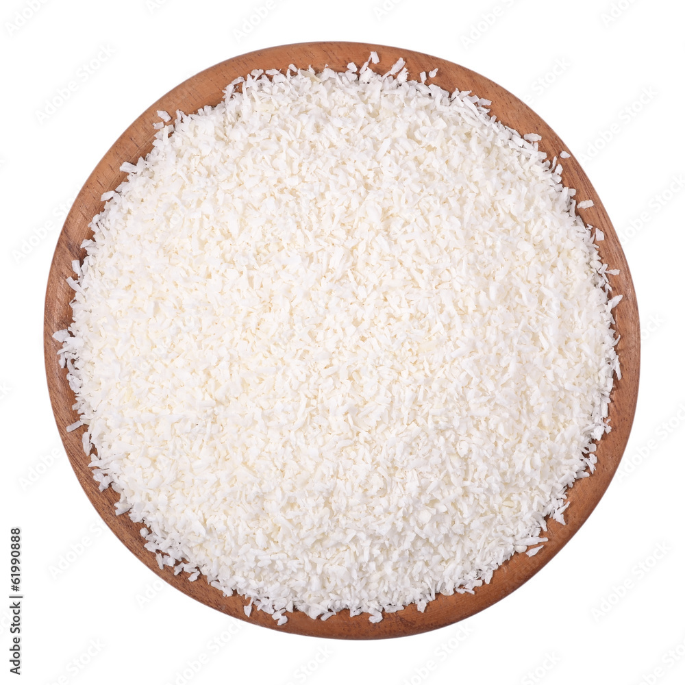 Shredded coconut in a wooden bowl on a white