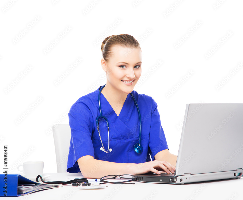A cheerful female doctor working in an office isolated on white A cheerful female doctor working in an office isolated on white