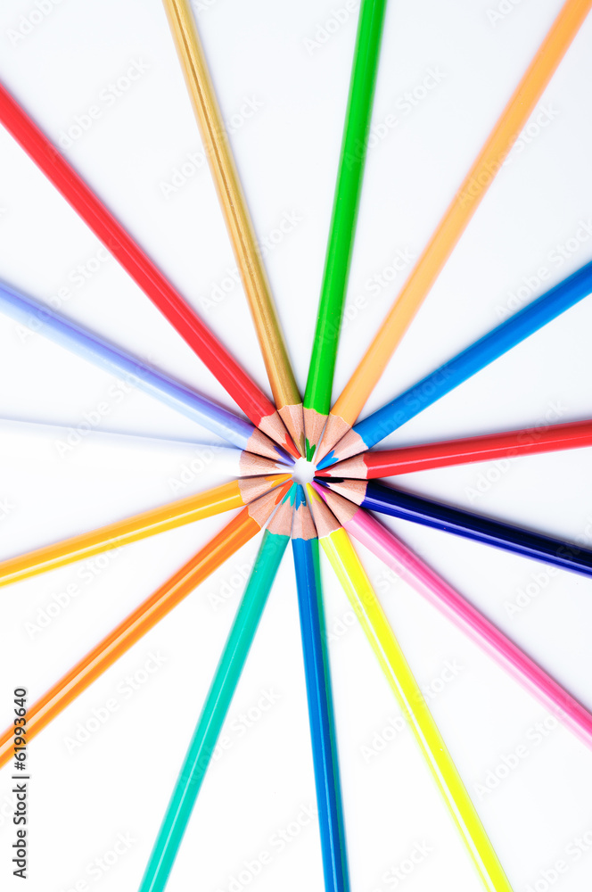 Color pencils pointing into the center on a white background Color pencils pointing into the center on a white background