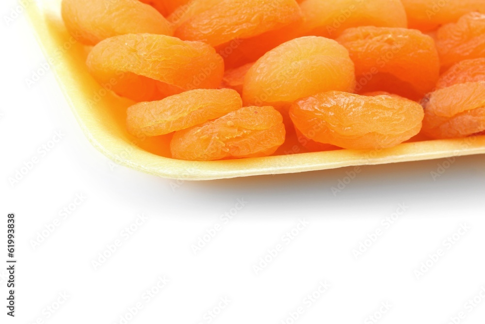 delicious dried apricots in packaging isolated on white delicious dried apricots in packaging isolated on white