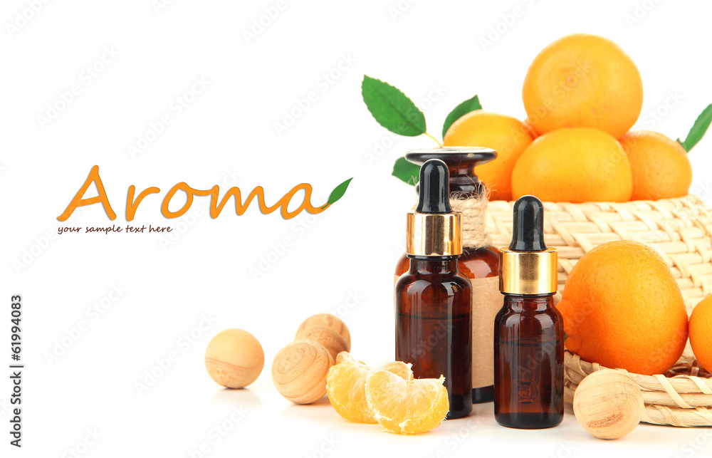 Tangerine essential oil and tangerines, isolated on white Tangerine essential oil and tangerines, isolated on white