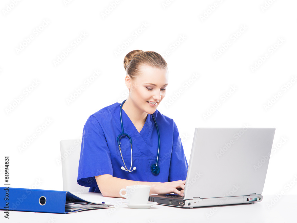 A cheerful female doctor working in an office A cheerful female doctor working in an office