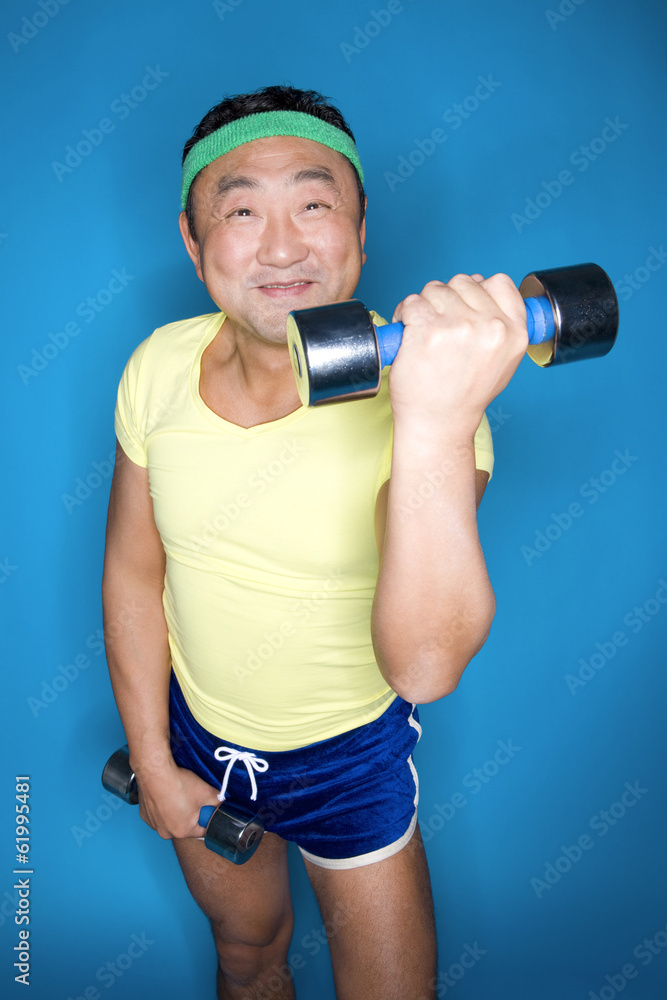 man lifting up dumbbell man lifting up dumbbell