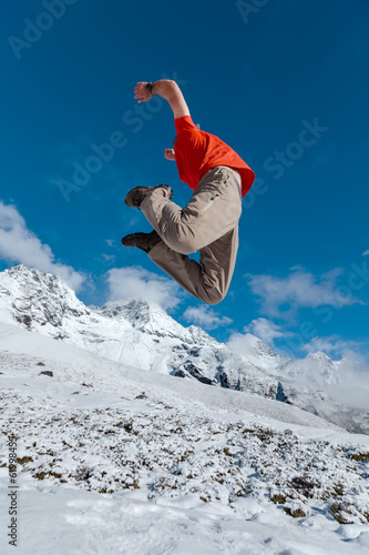 Hiker jumps in Himalaya mountains