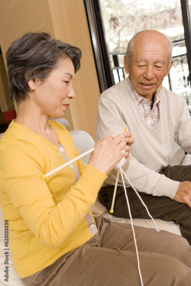 Fototapeta premium senior woman knitting and senior man