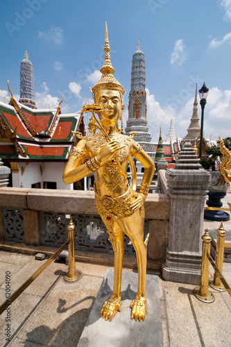 Golden Kinnari statue at Temple of Emerald Buddha  Wat Phra Kaew