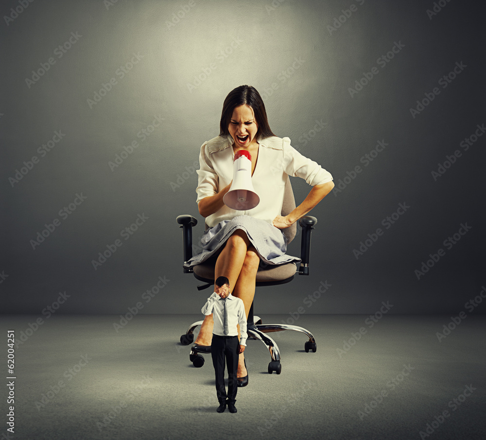 Fototapeta premium woman screaming at small man
