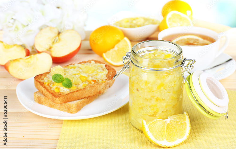 Delicious toasts with lemon jam on plate on table close-up Delicious toasts with lemon jam on plate on table close-up