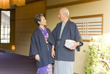 senior couple in yukata coming to hot spring