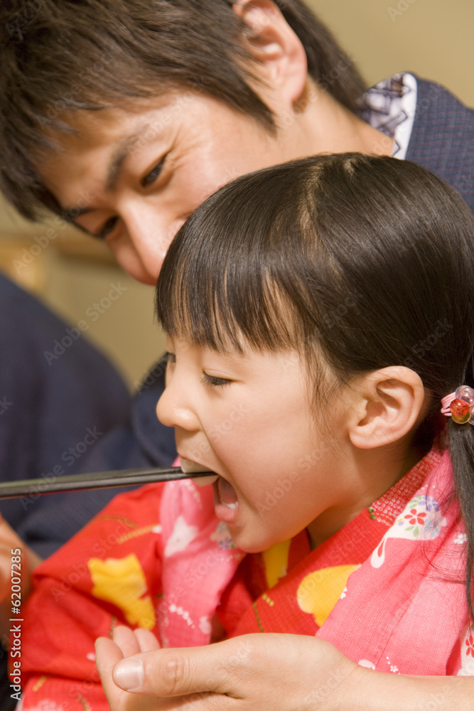 © TAGSTOCK2 - girl fed by father