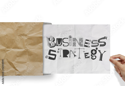 hand pulling crumpled paper from envelope with design word BUSIN
