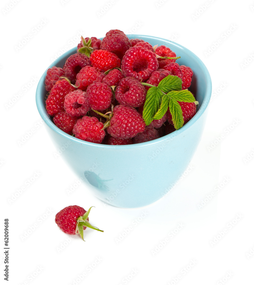 fresh raspberrie in a blue cup fresh raspberrie in a blue cup