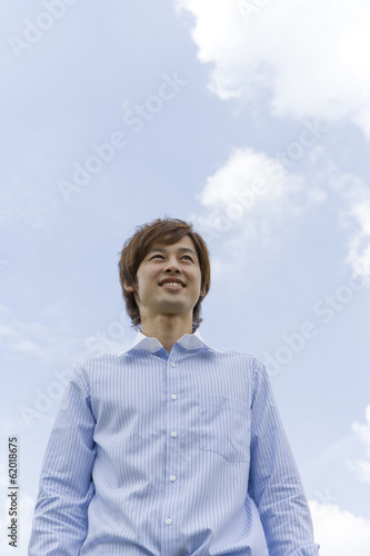smiling man and blue sky