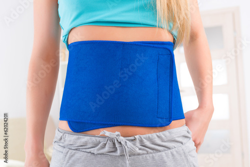 Fotografie Woman wearing slimming belt