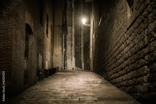 Empty street at night in Barri Gotic quarter in Barcelona, Spain