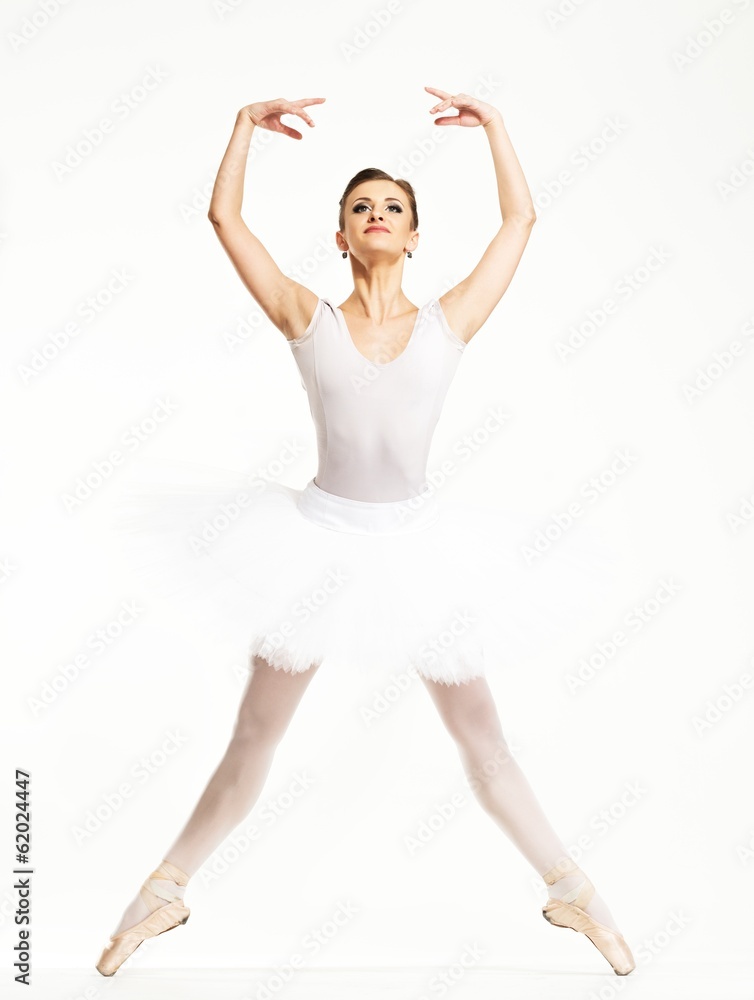 Young ballerina dancer in tutu showing her techniques