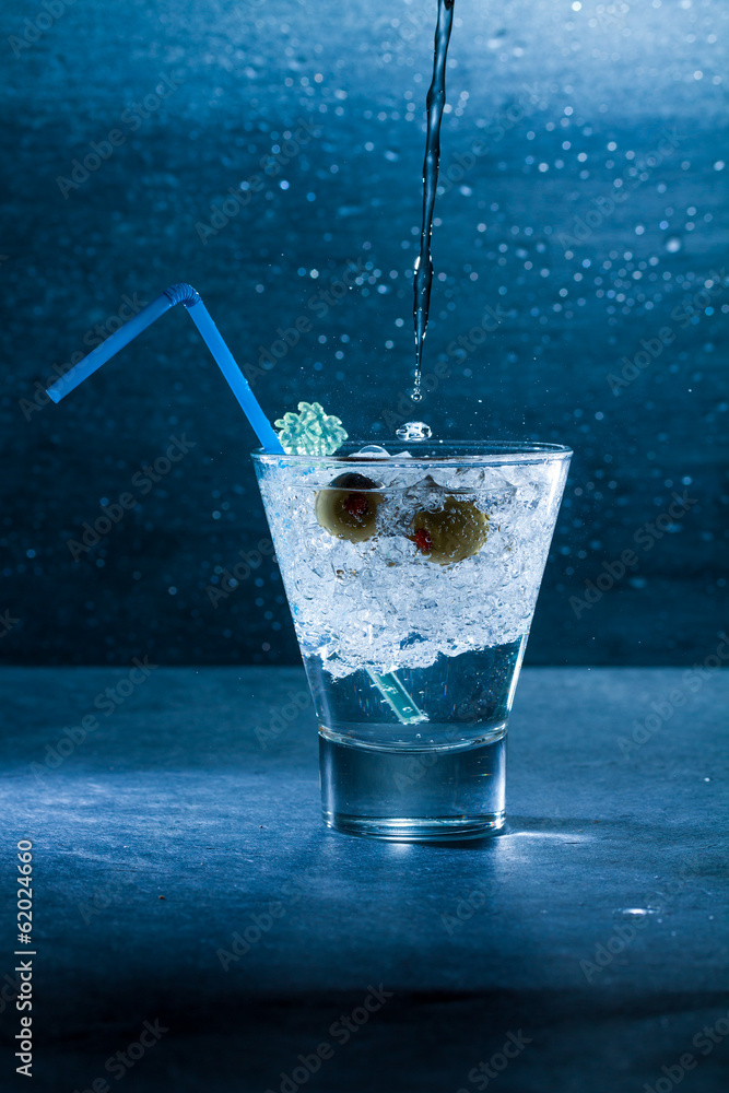 Gin Cocktail with crushed ice and olives