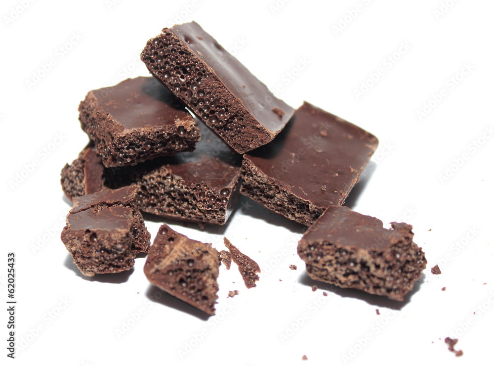 Broken chocolate bar on a white background Broken chocolate bar on a white background
