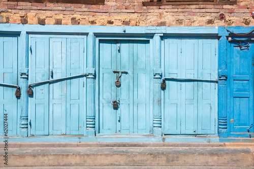 Blue doors locked with padlocks