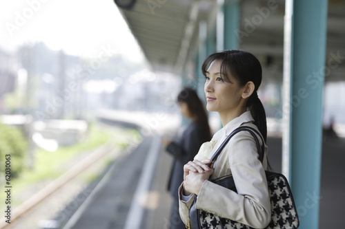 woman waiting for train on the platform