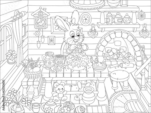 Easter bunny cooks a holiday cake