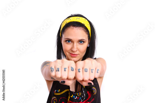 Rock girl showing her tattoos on her fist © majesticca