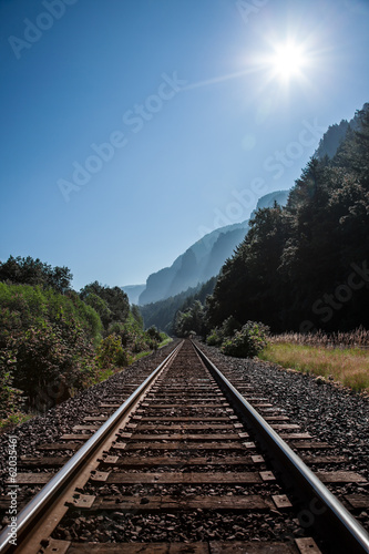 Railroad tracks lead to the horizon