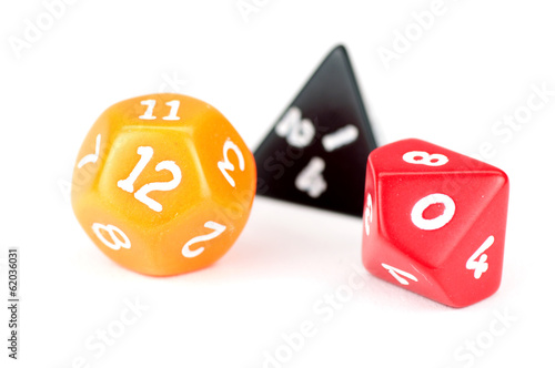 Three colored dice on white