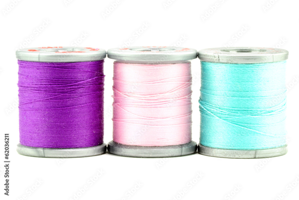 One each spool of purple, pink, and blue thread One each spool of purple, pink, and blue thread