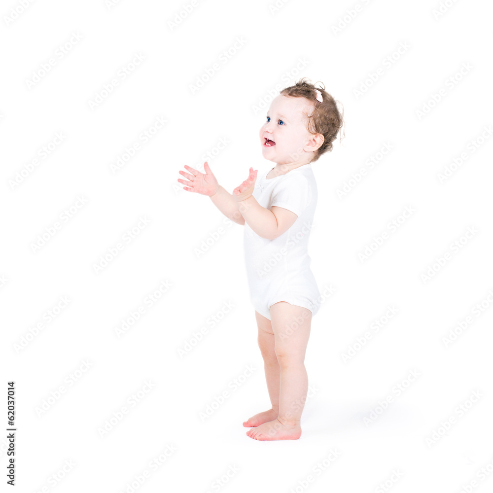 Funny baby girl clapping hands, on white background Funny baby girl clapping hands, on white background