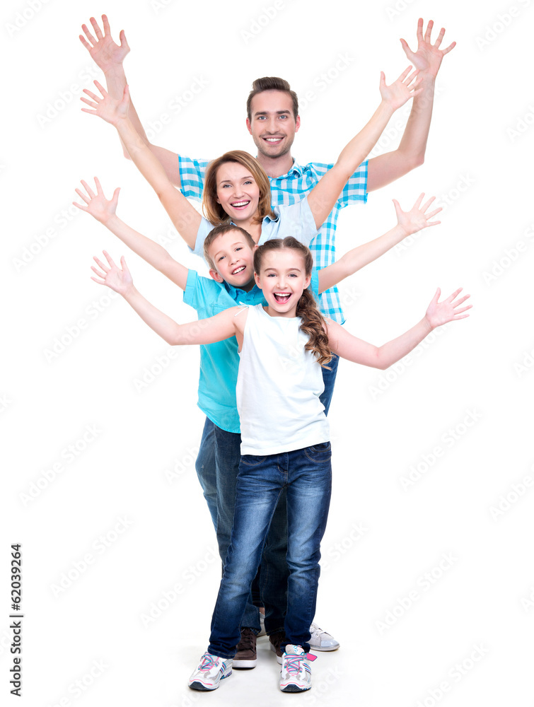 Young happy family with children raised hands up Young happy family with children raised hands up