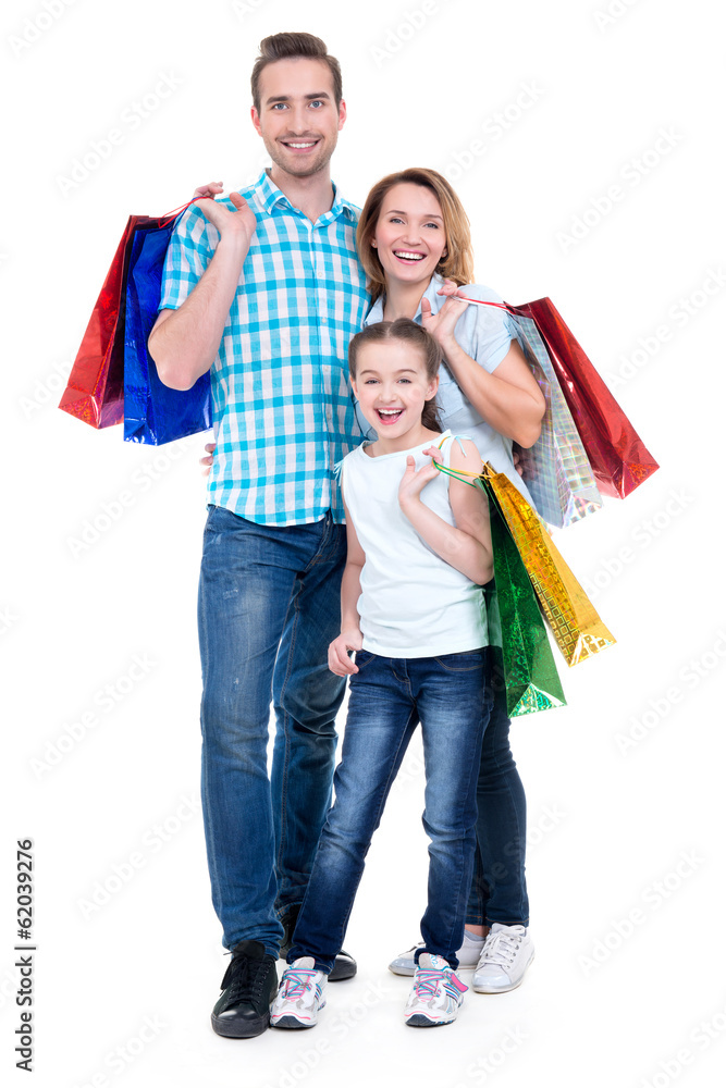 Happy american family with child holding shopping bags Happy american family with child holding shopping bags