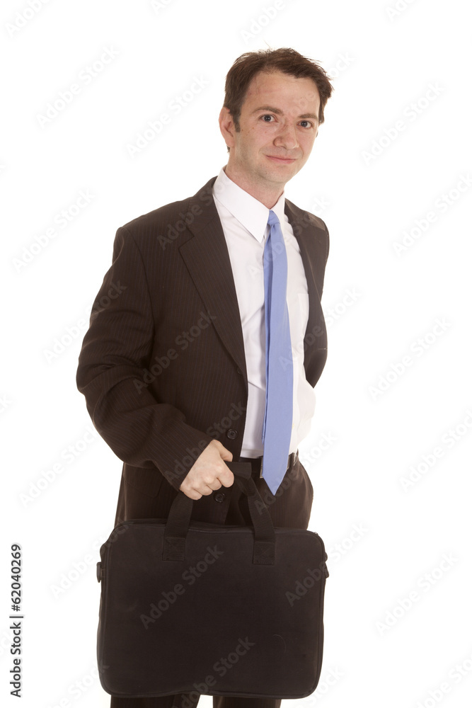 Man in suit with bag in front looking Man in suit with bag in front looking
