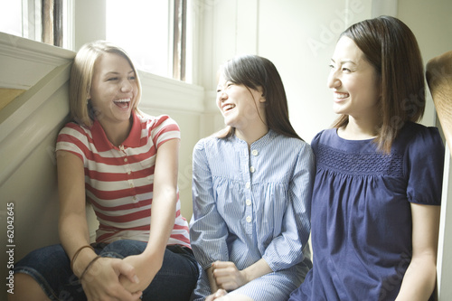 three women talking with smile