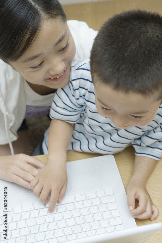 sister and younger brother using PC sister and younger brother using PC
