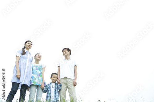 smiling family holding hands