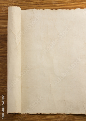 parchment scroll on wood