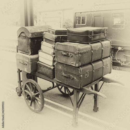 Luggage on porter's trolley on railways station photo