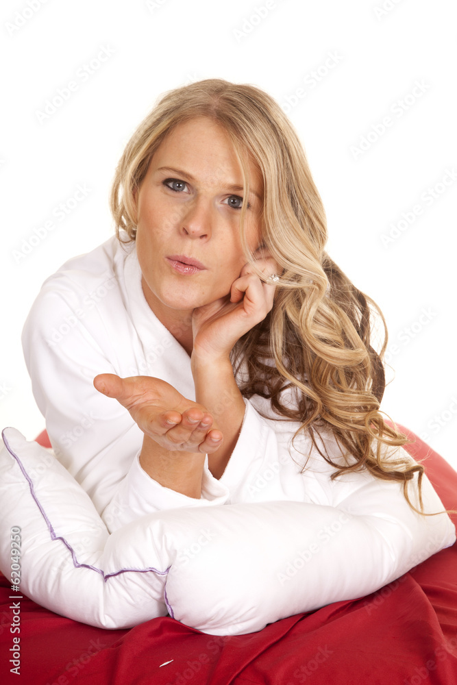 Woman white robe red sheet lay blow kiss Woman white robe red sheet lay blow kiss