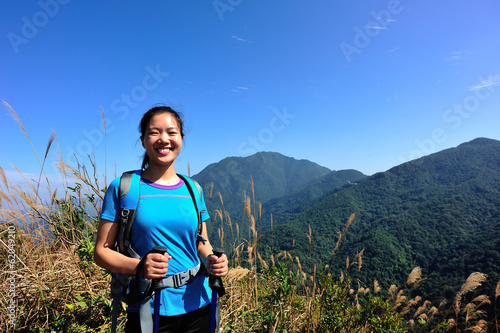woman hiker at mountain peak