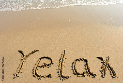 relax word drawn on beach © lzf