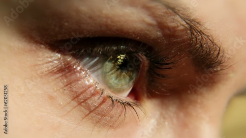 A girl eye wearing cosmetic contact lens (Gold). photo