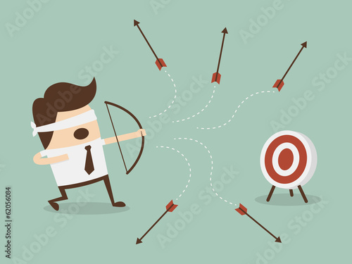 Blindfold businessman shooting arrow
