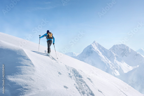 Touring skier in the alps photo