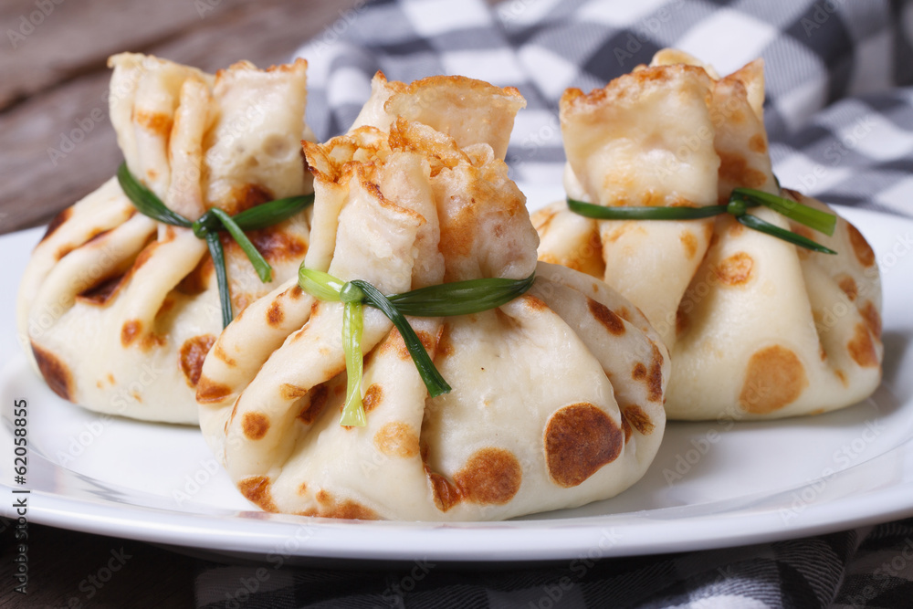 three beautiful stuffed pancake on white plate