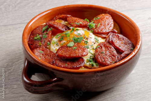 Spanish tapas with potatoes, iberian ham, chorizo sausage,egg