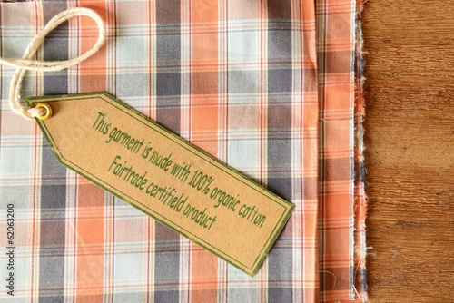 Plaid garment with certified organic fabric label.