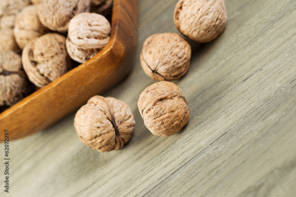Close up of Whole Walnuts on Faded Wood Close up of Whole Walnuts on Faded Wood