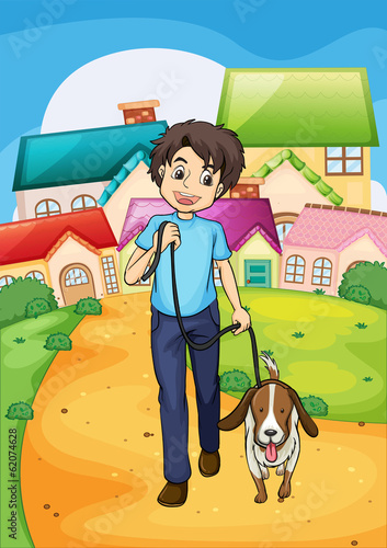 A happy young boy walking with his pet
